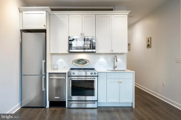 a view of room with wooden floor