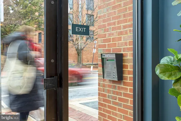 a view of parking garage with cars parked
