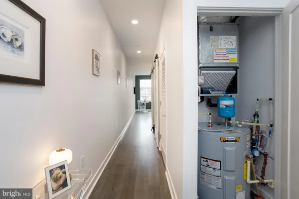 a view of a hallway with washer and dryer