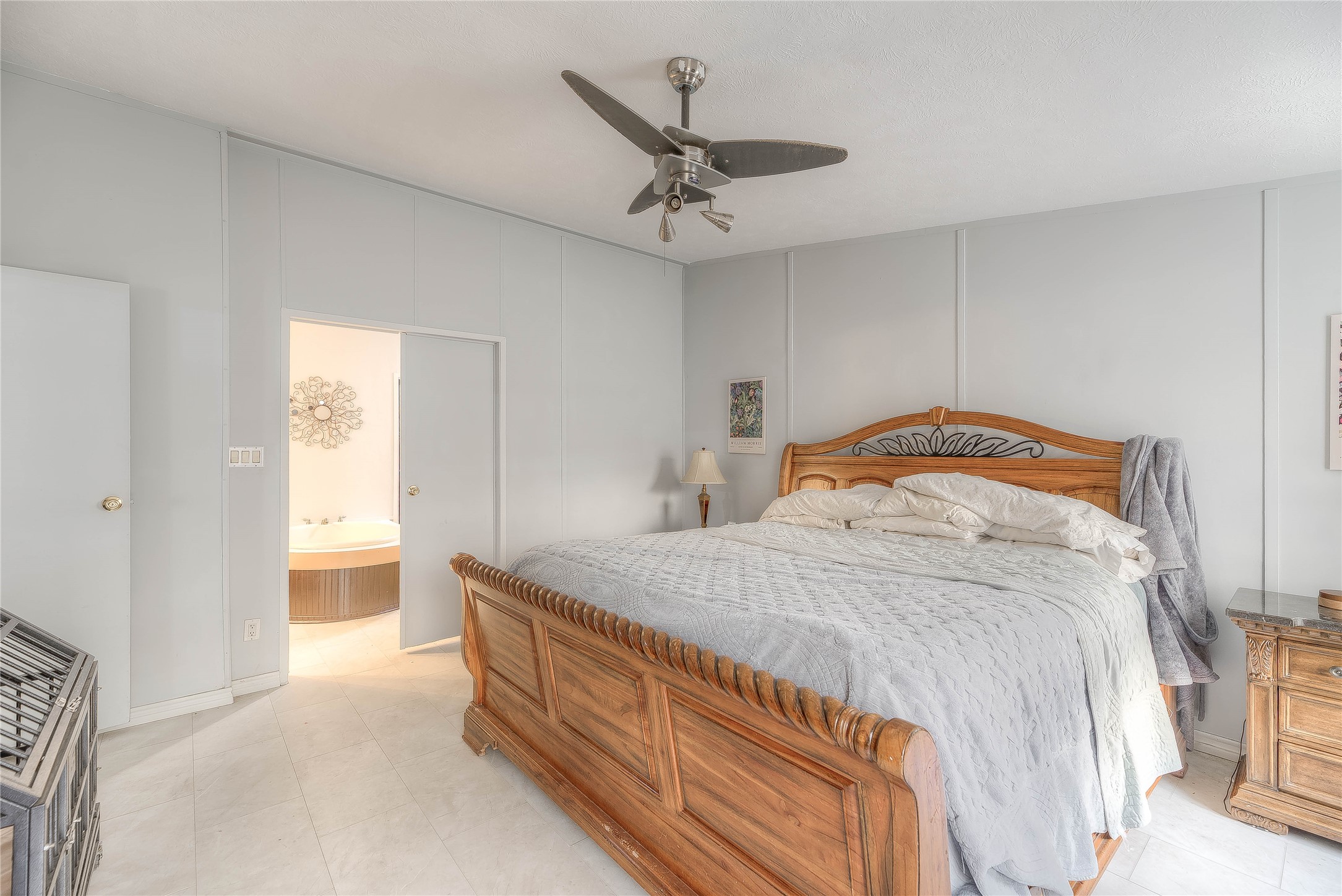 17709 Pine View Drive Conroe, TX 77302 - Photo 20 of 26 a bedroom with a bed and a ceiling fan