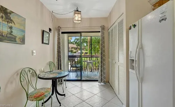 a view of a livingroom with furniture and a window