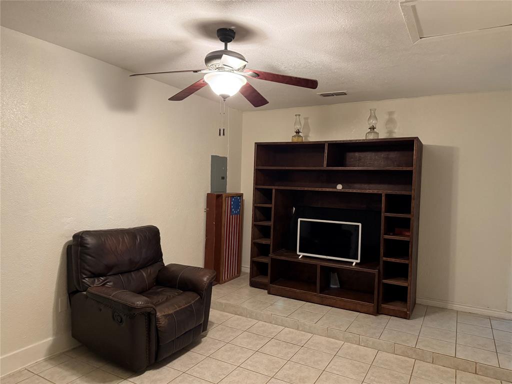 58 Roberts Road Mineral Wells, TX 76067 - Photo 18 of 28 a living room with furniture and a fireplace