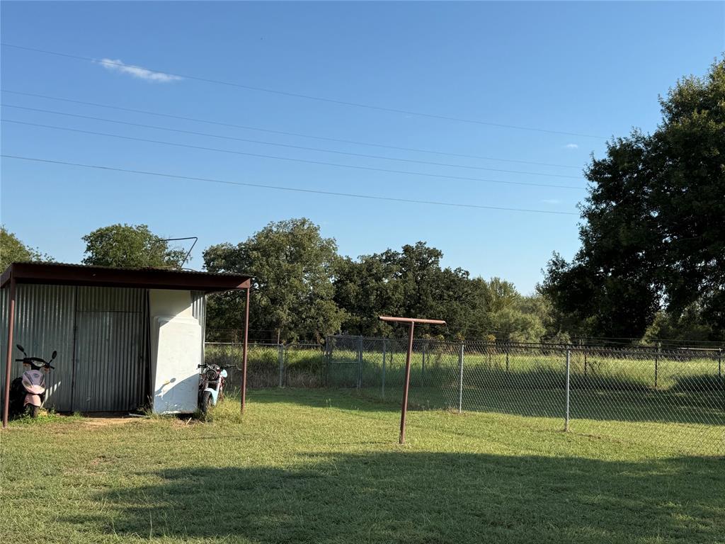 58 Roberts Road Mineral Wells, TX 76067 - Photo 28 of 28 a view of outdoor space with deck and yard