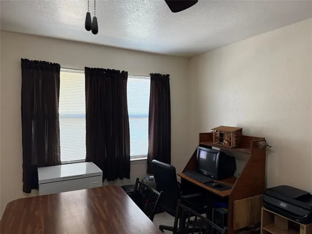 a room with furniture and wooden floor