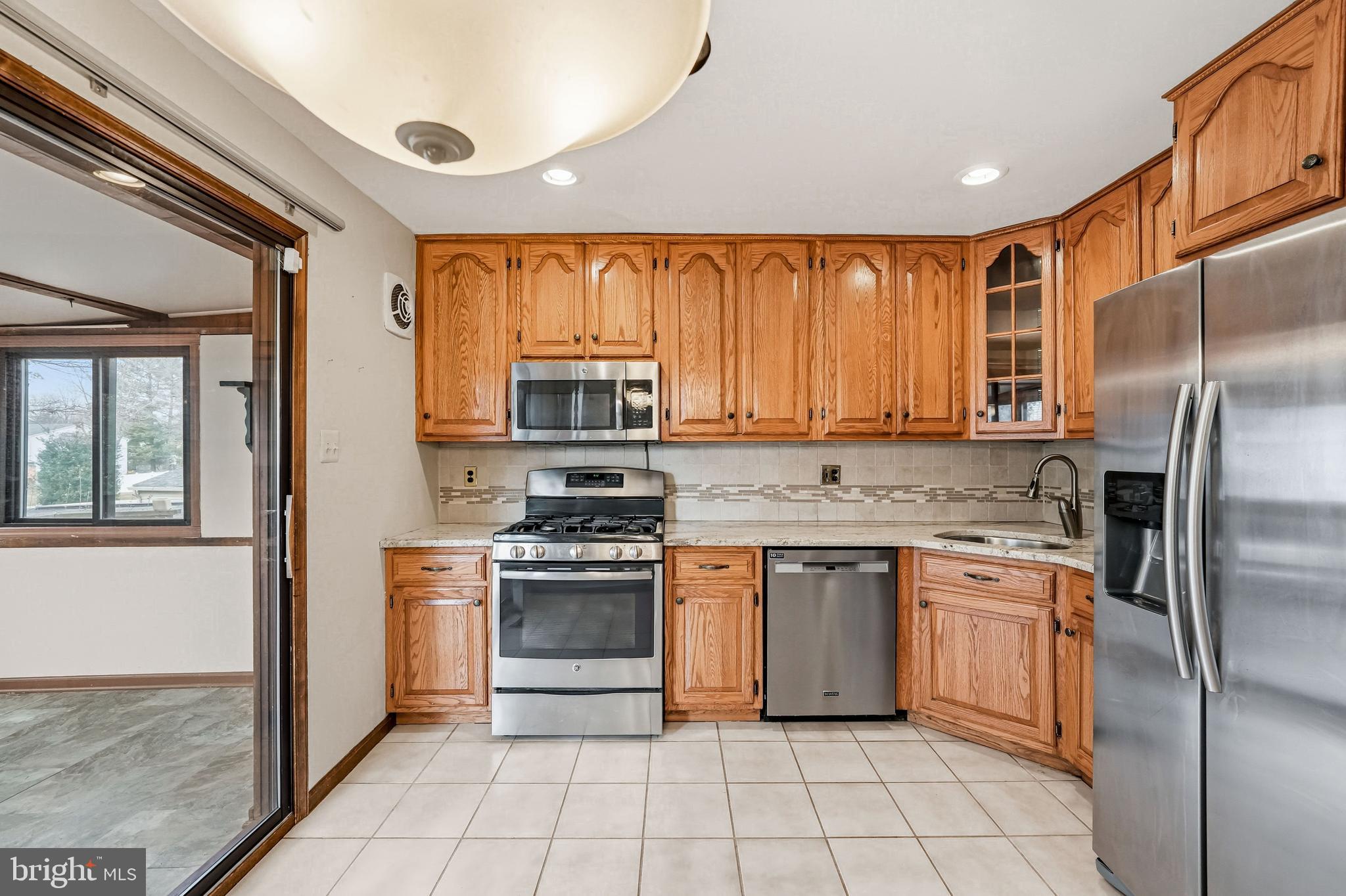2 Winding Way Berlin, NJ 08009 - Photo 11 of 31 a kitchen with a stove a sink and a refrigerator