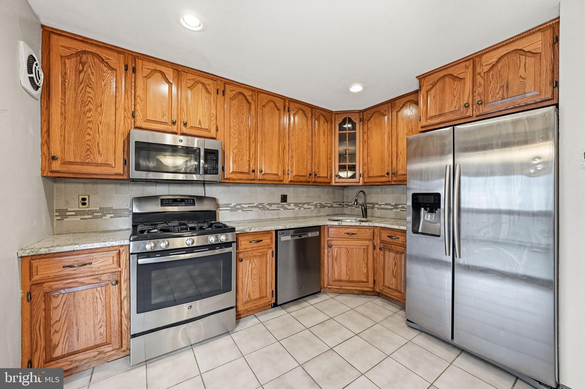 2 Winding Way Berlin, NJ 08009 - Photo 12 of 31 a kitchen with stainless steel appliances granite countertop a refrigerator stove top oven a sink and dishwasher