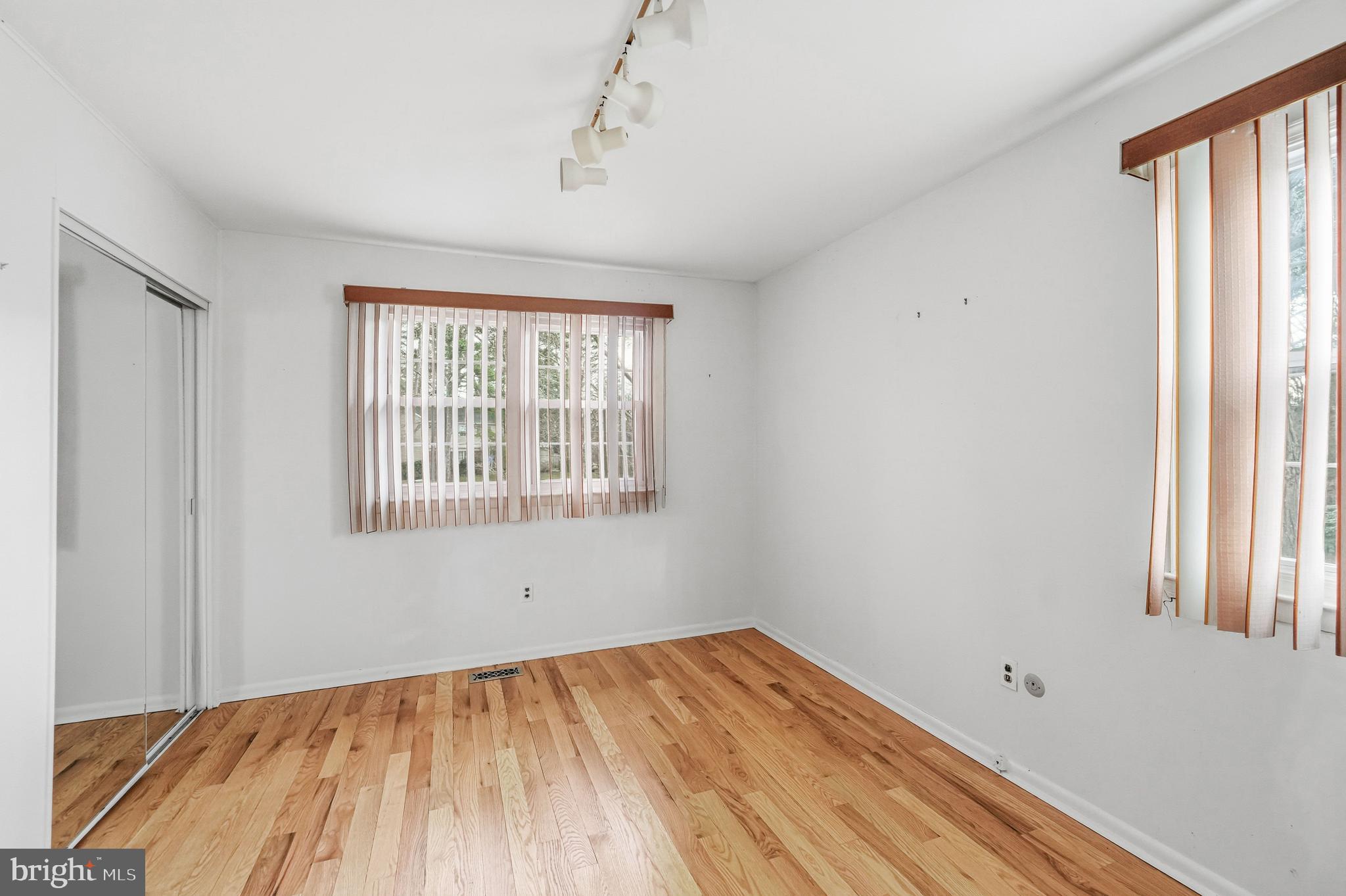 2 Winding Way Berlin, NJ 08009 - Photo 18 of 31 a view of empty room with wooden floor and fan