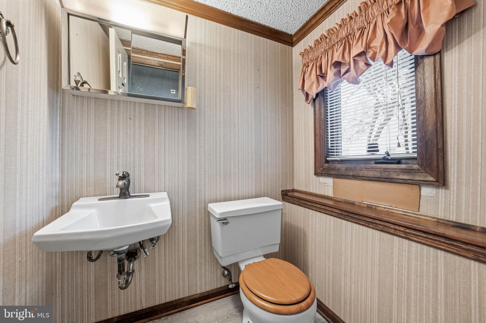 2 Winding Way Berlin, NJ 08009 - Photo 26 of 31 a bathroom with a sink a toilet and mirror