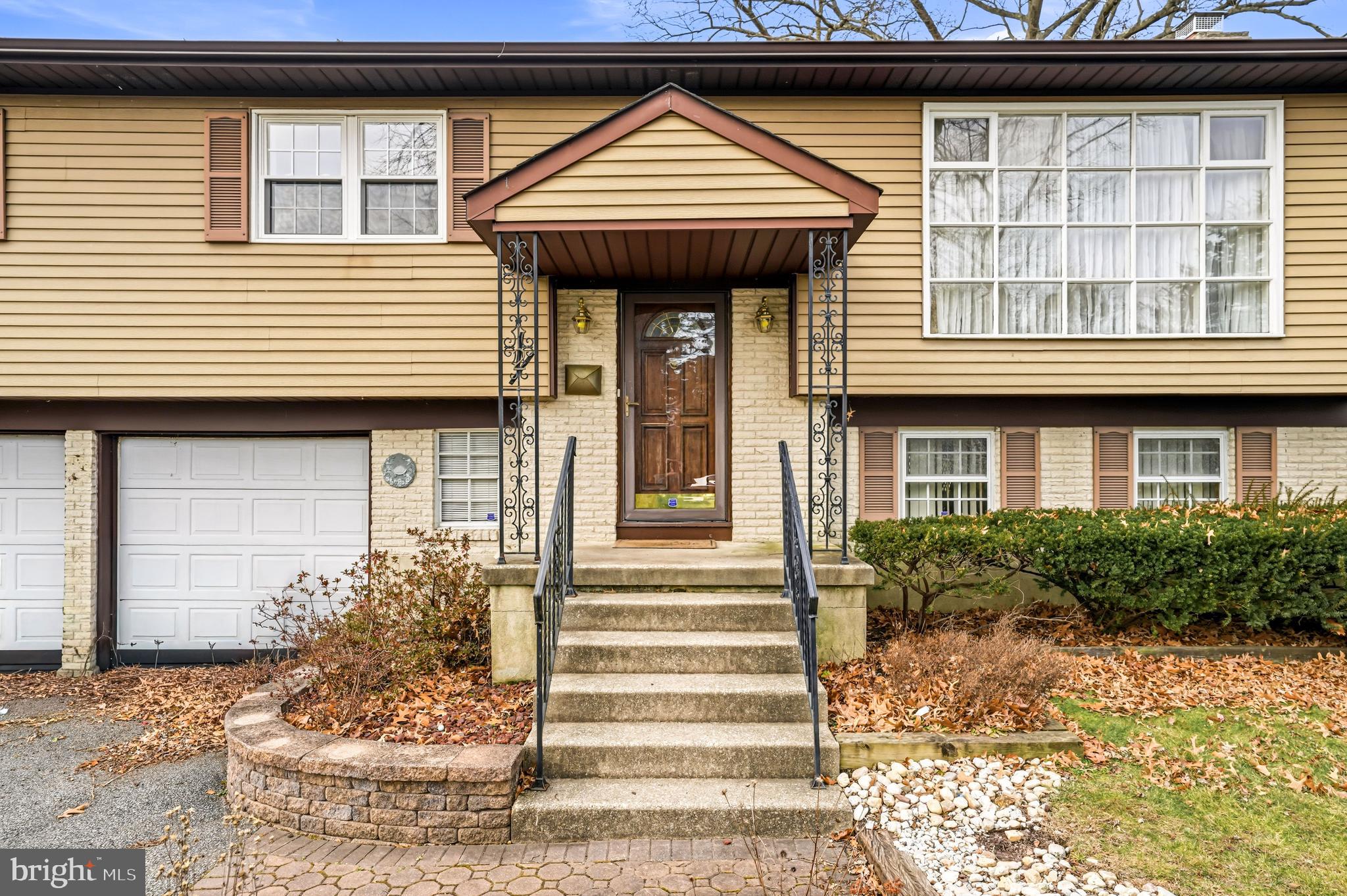 2 Winding Way Berlin, NJ 08009 - Photo 3 of 31 a view of a house with entrance and a window