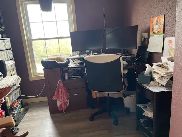 a workspace with furniture and a window