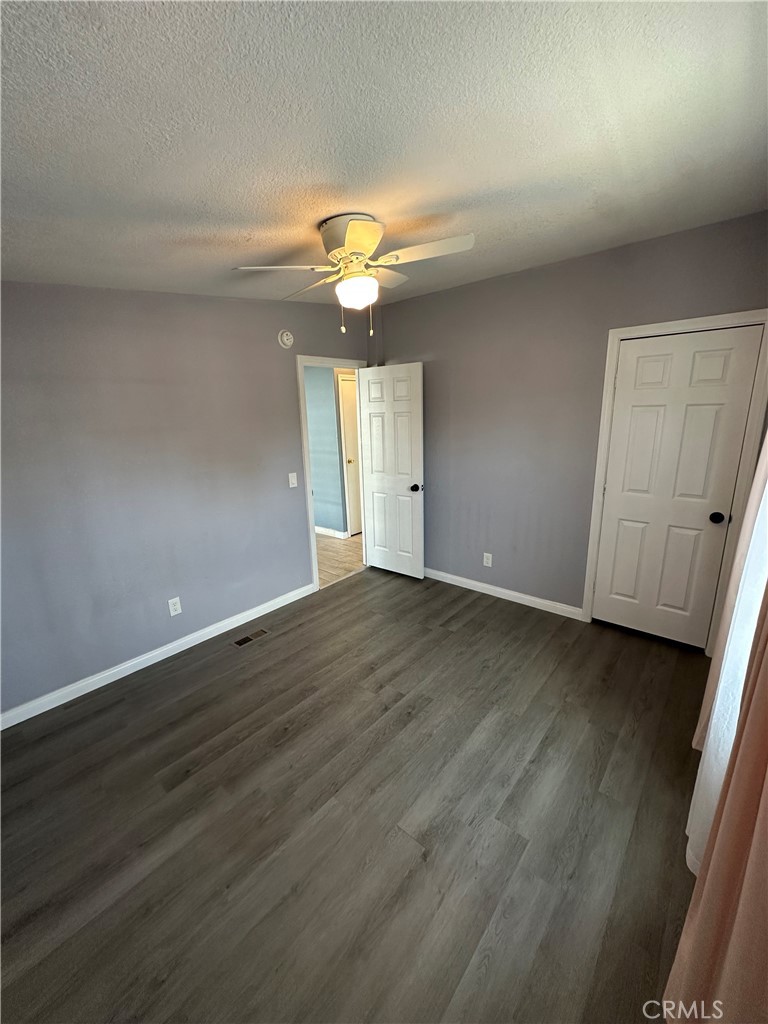 3825 Crestmore Road, Unit 414 Riverside, CA 92509 - Photo 15 of 31 an empty room with wooden floor and windows