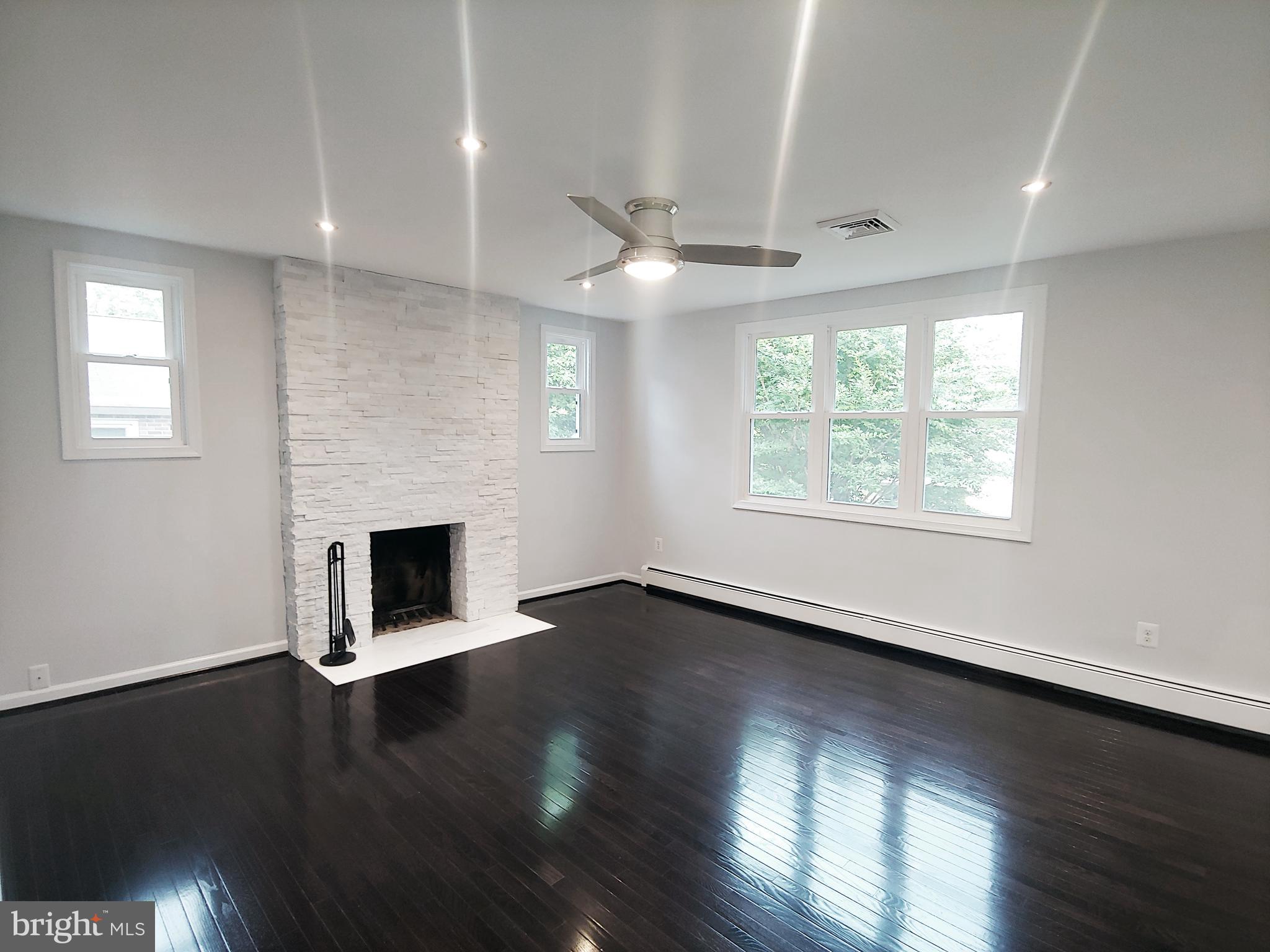 2630 East Maple Street Alexandria, VA 22306 - Photo 4 of 28 Living Room with Custom-tiled Fireplace