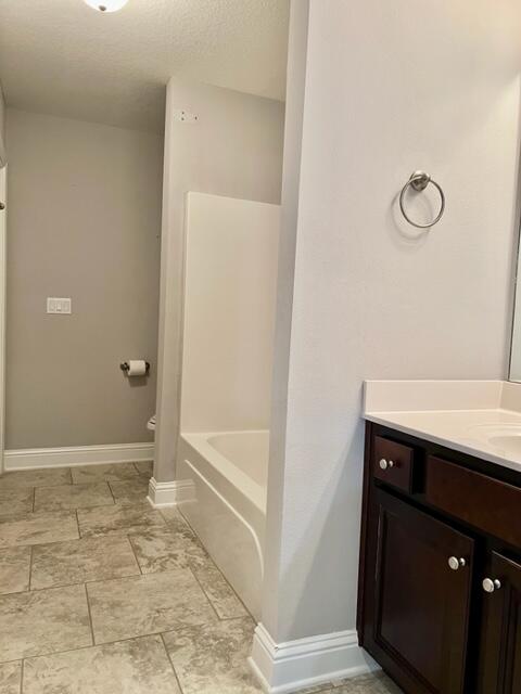 6123 Walk Along Way Crestview, FL 32536 - Photo 44 of 50 a bathroom with a sink and a mirror