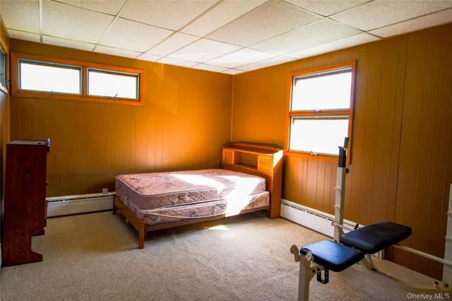 a bathroom with a toilet a sink and window