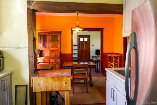 a view of a livingroom with furniture window and wooden floor