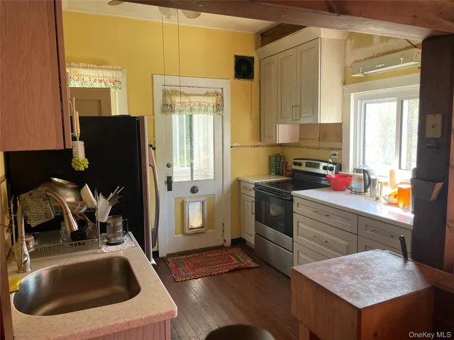 a bathroom with a toilet and a shower curtain