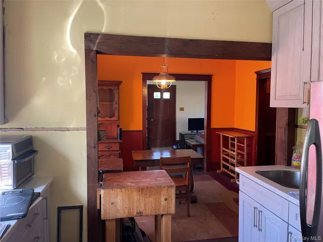 a bed room with a bed and a lamp