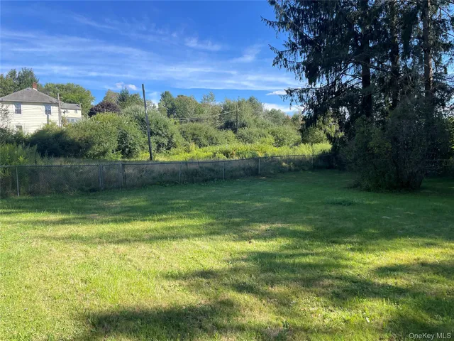 a view of balcony with wooden floor