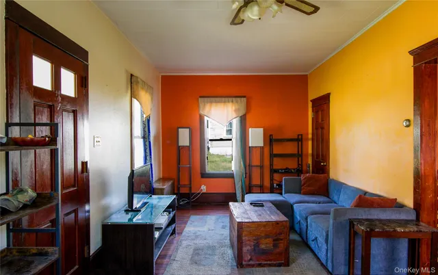 a bedroom with furniture and large windows