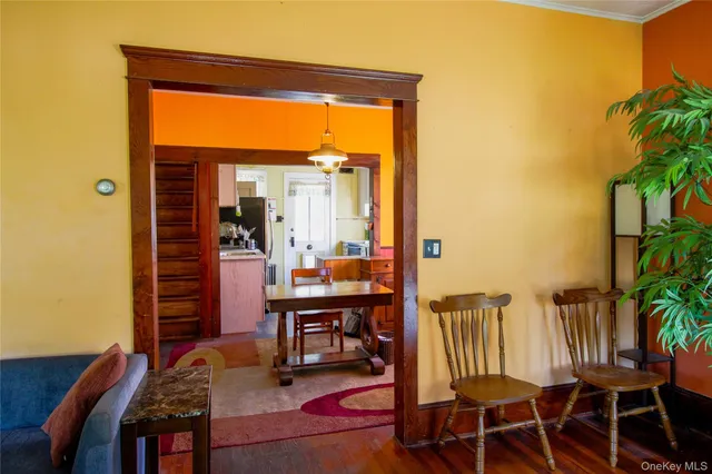 a view of balcony with wooden floor and outdoor seating