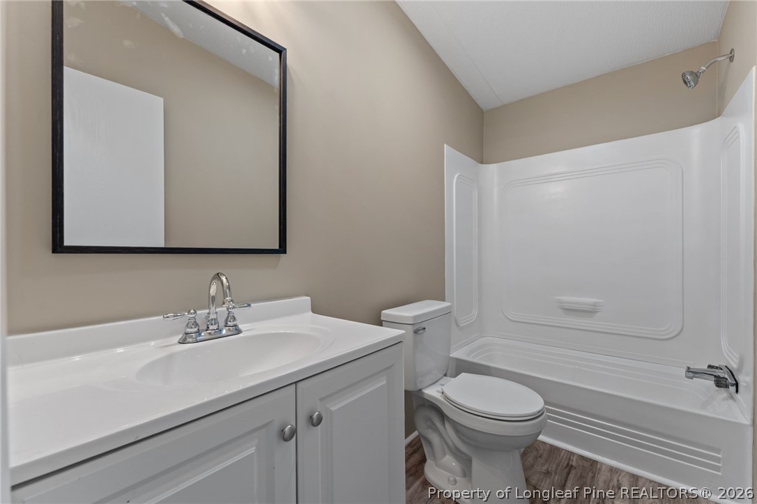 515 Mt Zion Road Red Springs, NC 28377 - Photo 16 of 50 a bathroom with a sink toilet and shower