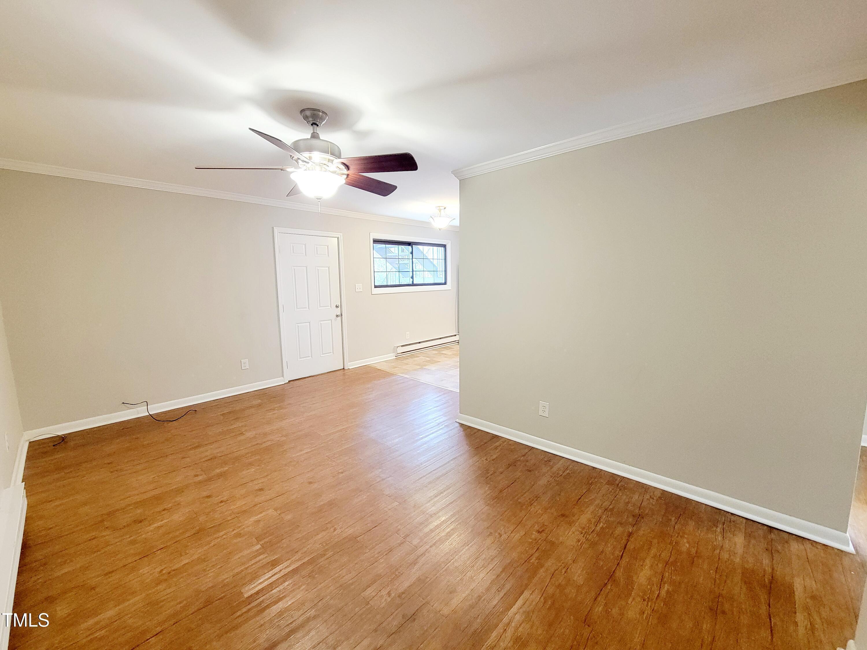 1422 Scales Street, Unit C Raleigh, NC 27608 - Photo 13 of 37 a view of empty room with wooden floor