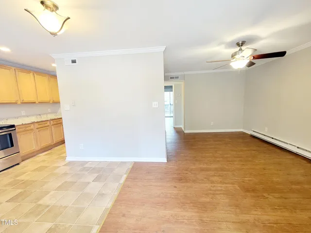 a view of a kitchen with a dishwasher and a white cabinets