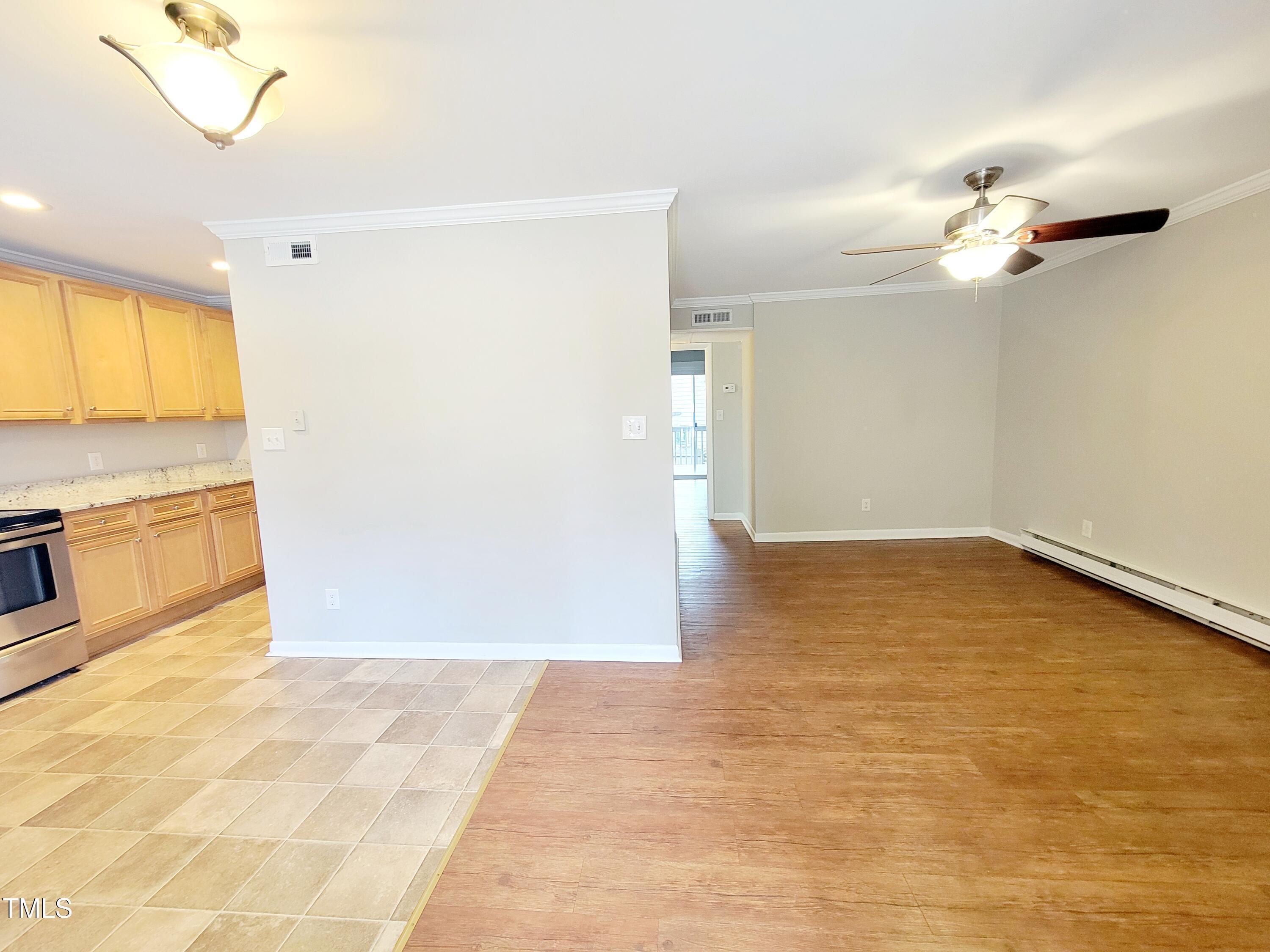 1422 Scales Street, Unit C Raleigh, NC 27608 - Photo 2 of 37 a view of a kitchen with a dishwasher and a white cabinets