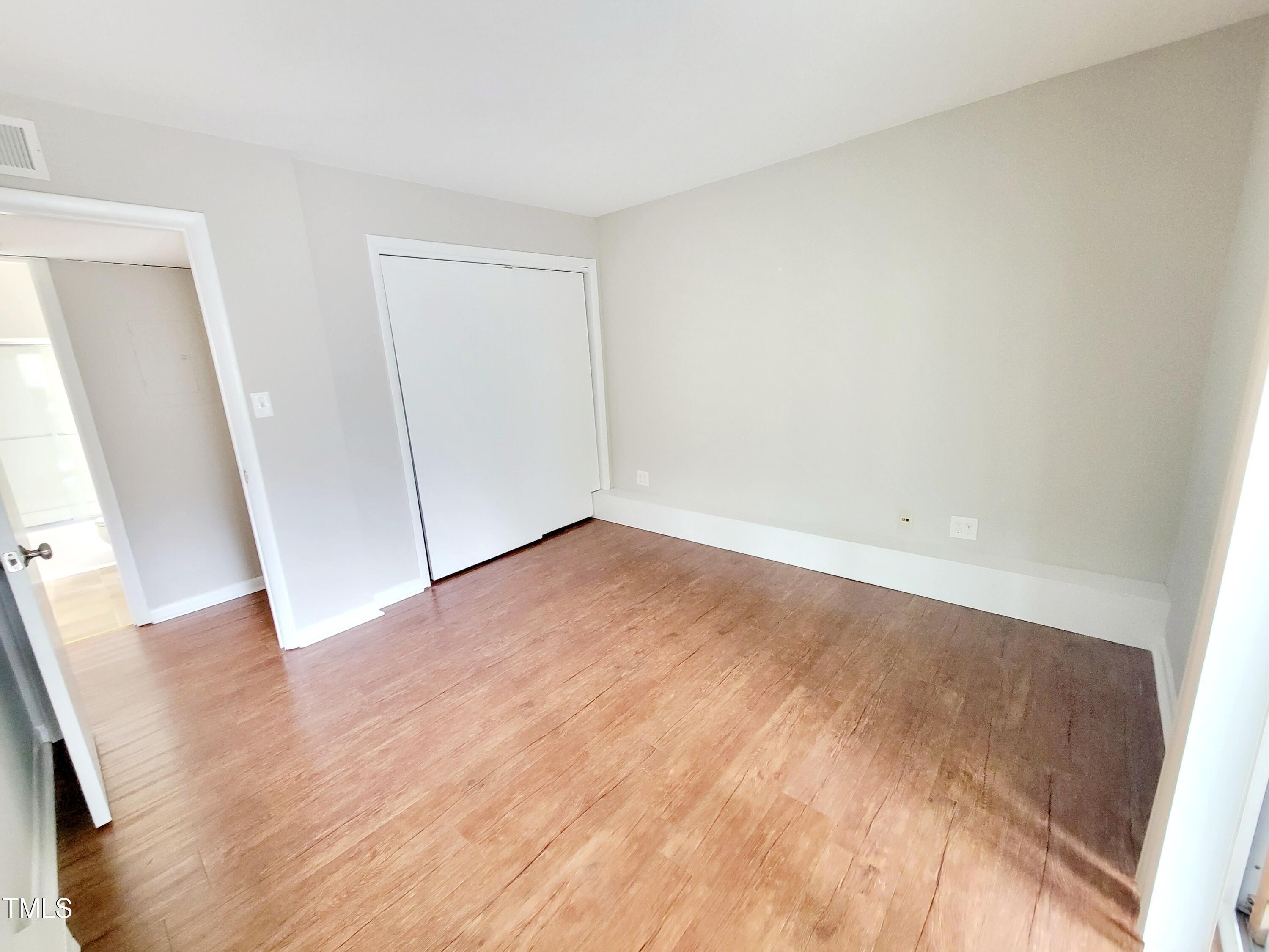 1422 Scales Street, Unit C Raleigh, NC 27608 - Photo 24 of 37 an empty room with wooden floor