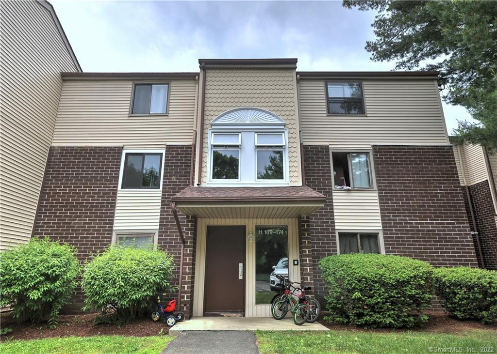 7 Padanaram Road, Unit H174 Danbury, CT 06811 - Photo 1 of 1 front view of a house with a yard