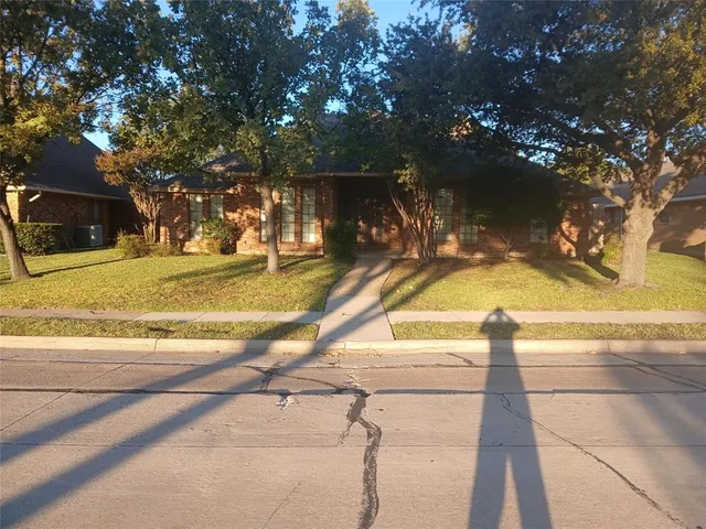 a view of a yard with swimming pool