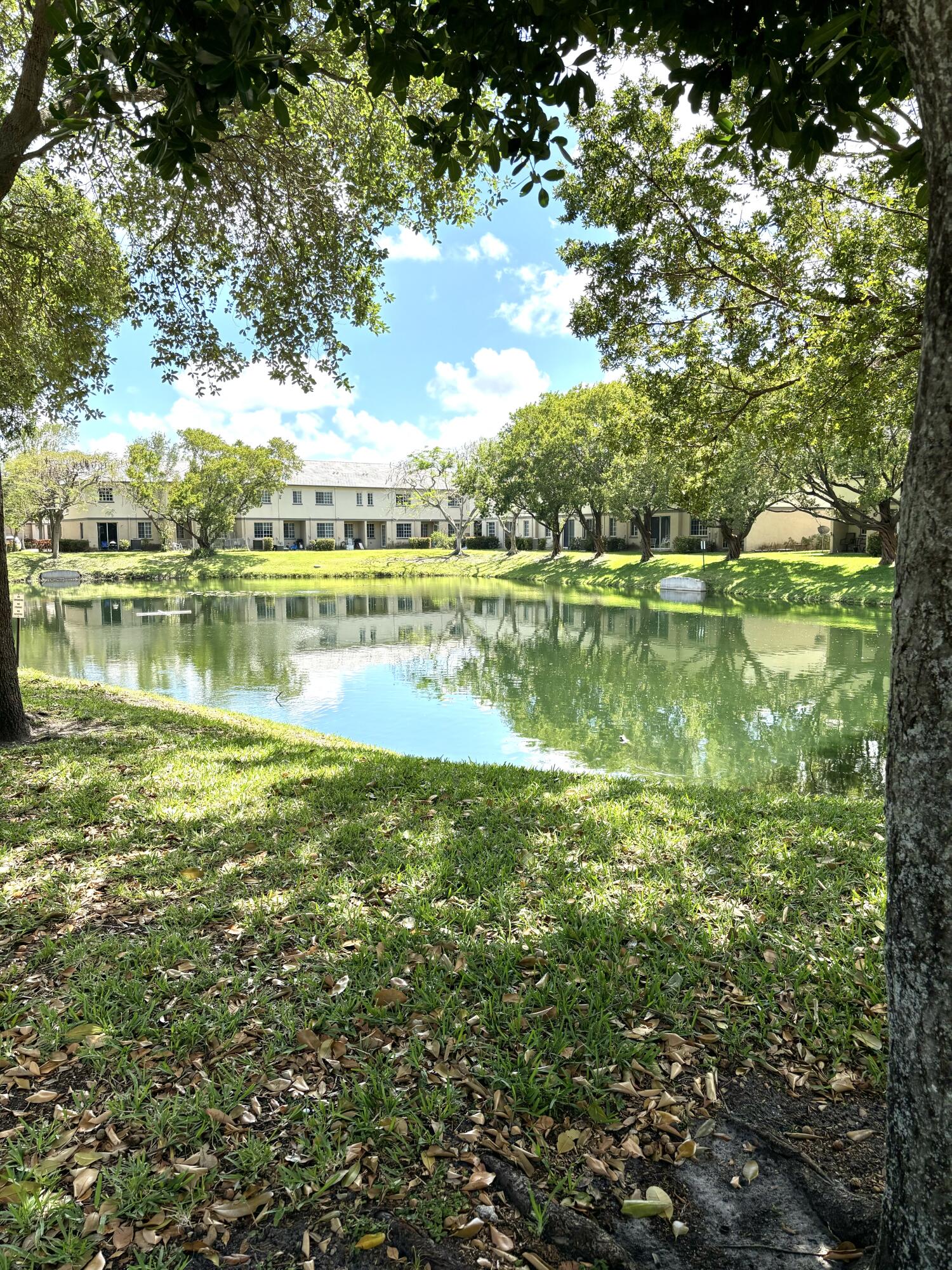 1964 Freeport Drive, Unit 1964 Riviera Beach, FL 33404 - Photo 20 of 20 a view of a lake with houses in outdoor space