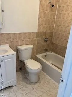 a bathroom with a toilet a sink and bathtub