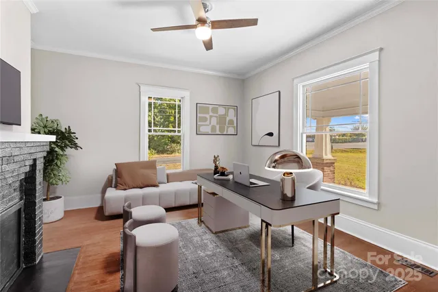 a living room with furniture and a fireplace