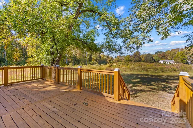 a balcony with wooden floor