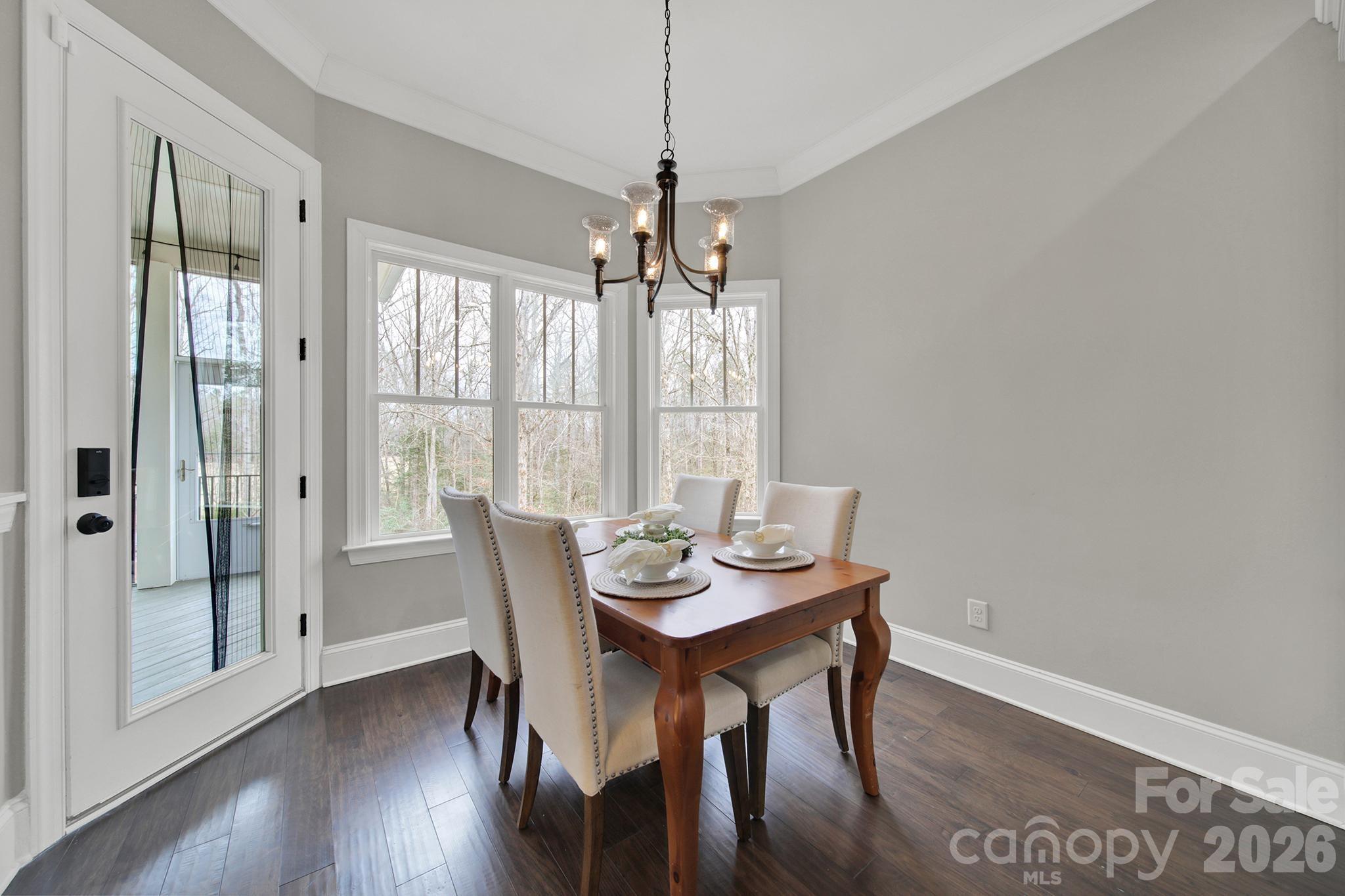2112 Tatton Hall Road Fort Mill, SC 29715 - Photo 12 of 46 a view of a dining room with furniture window and wooden floor