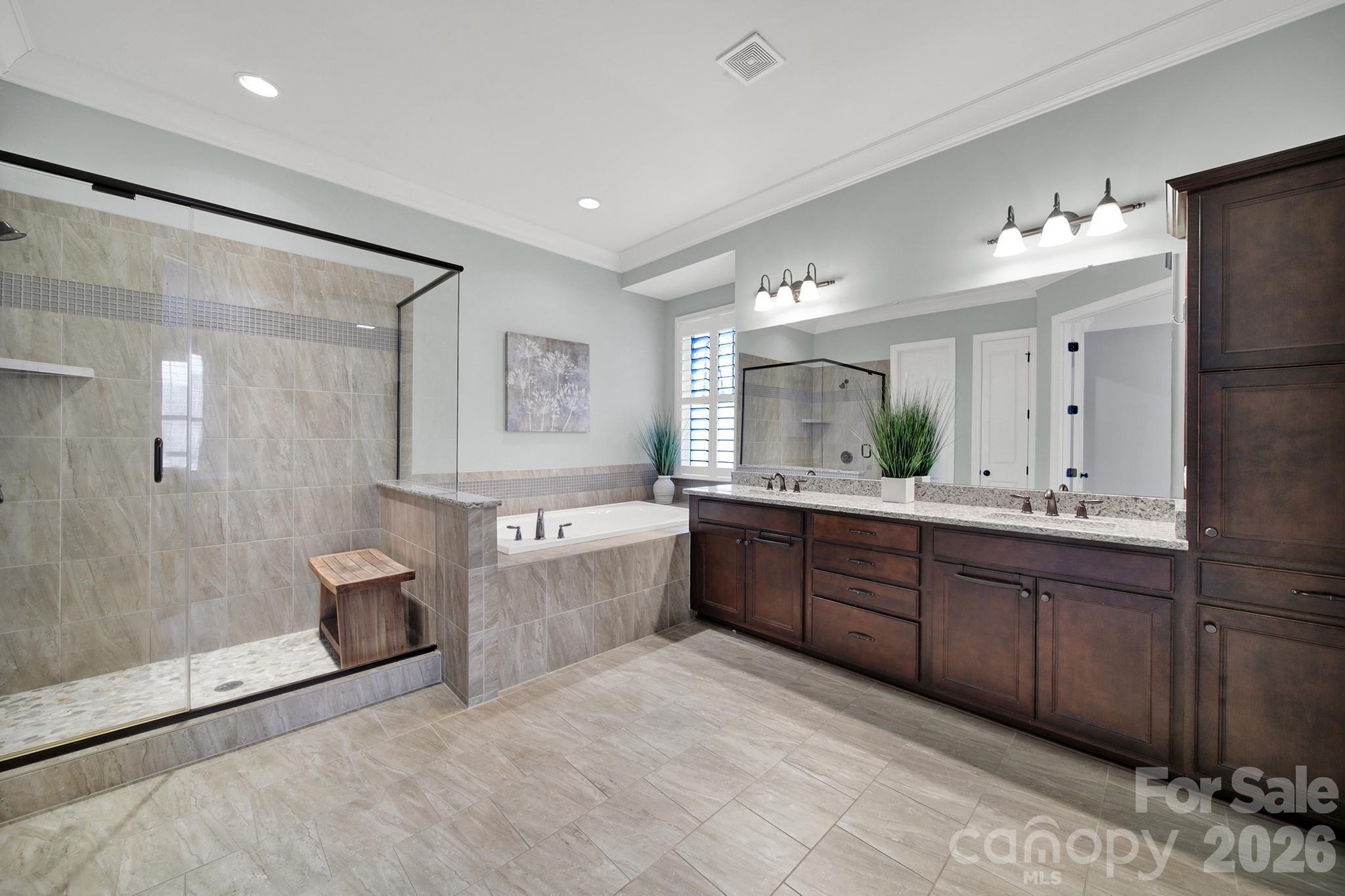 2112 Tatton Hall Road Fort Mill, SC 29715 - Photo 16 of 46 a large bathroom with a granite countertop tub sink and mirror