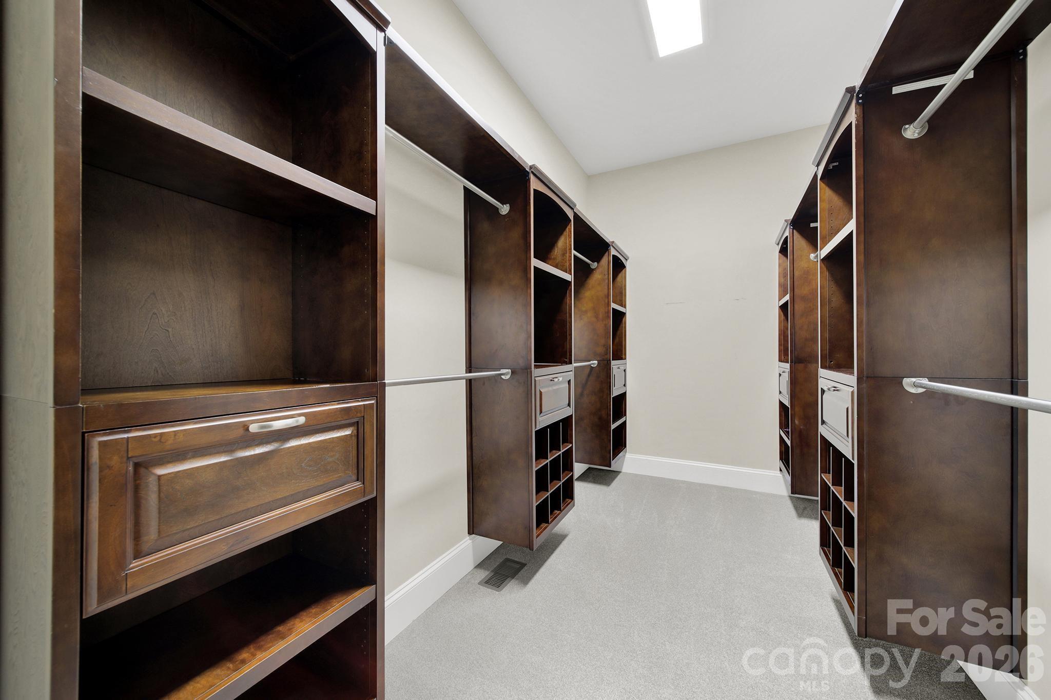2112 Tatton Hall Road Fort Mill, SC 29715 - Photo 17 of 46 a view of walk in closet with clothes and shoes