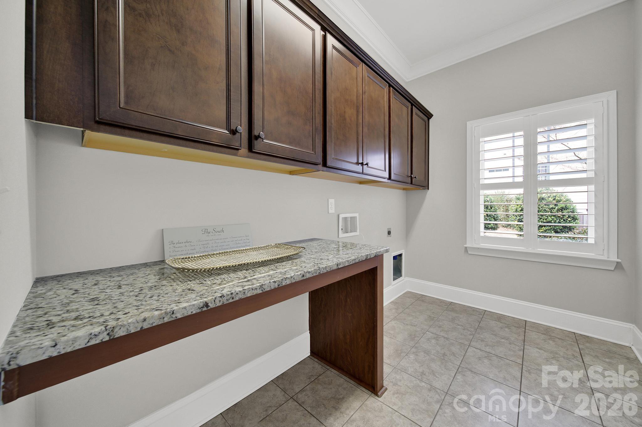 2112 Tatton Hall Road Fort Mill, SC 29715 - Photo 19 of 46 a kitchen with granite countertop cabinets and window