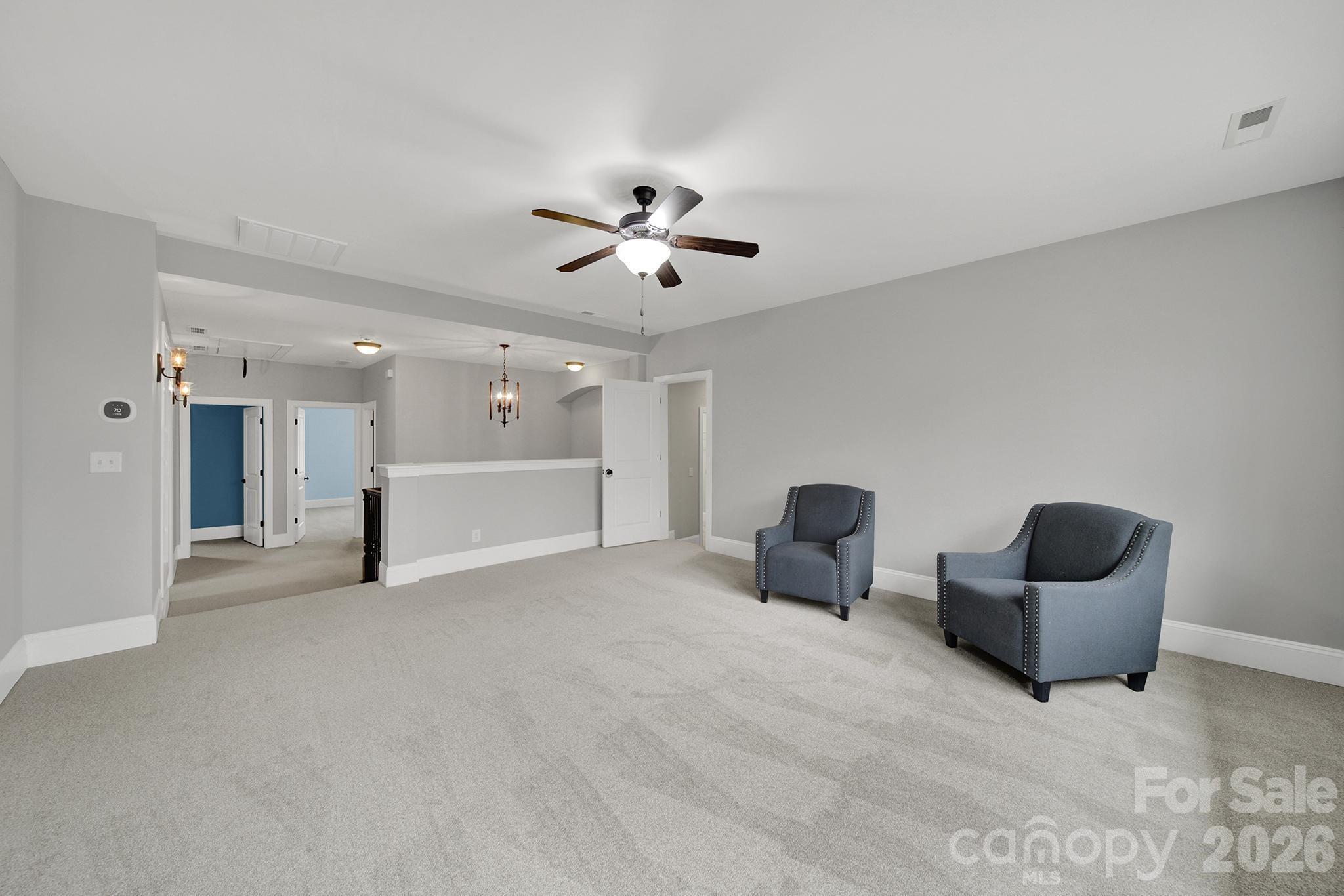 2112 Tatton Hall Road Fort Mill, SC 29715 - Photo 21 of 46 a view of a livingroom with furniture and a ceiling fan