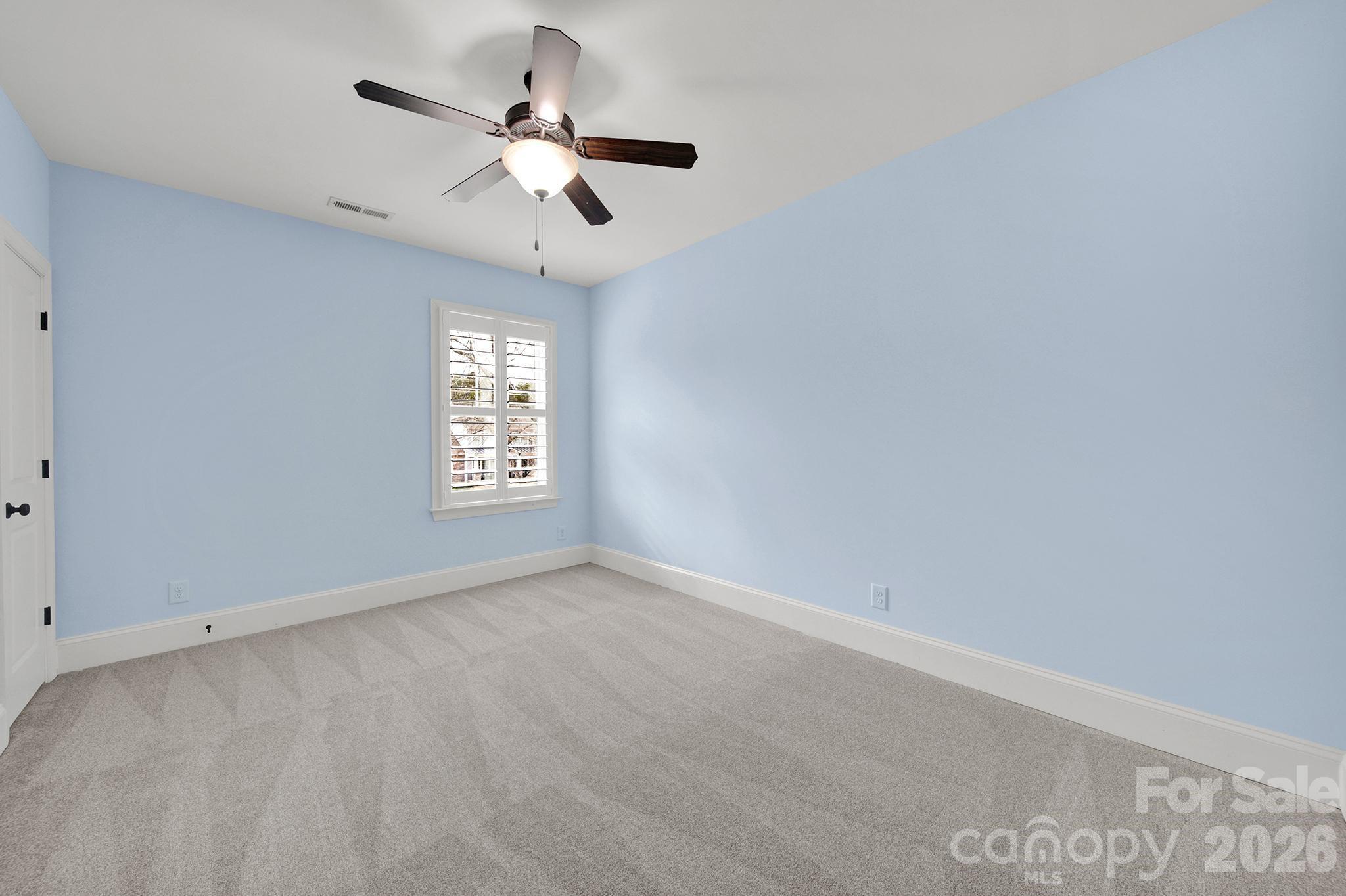 2112 Tatton Hall Road Fort Mill, SC 29715 - Photo 23 of 46 an empty room with a window and a ceiling fan