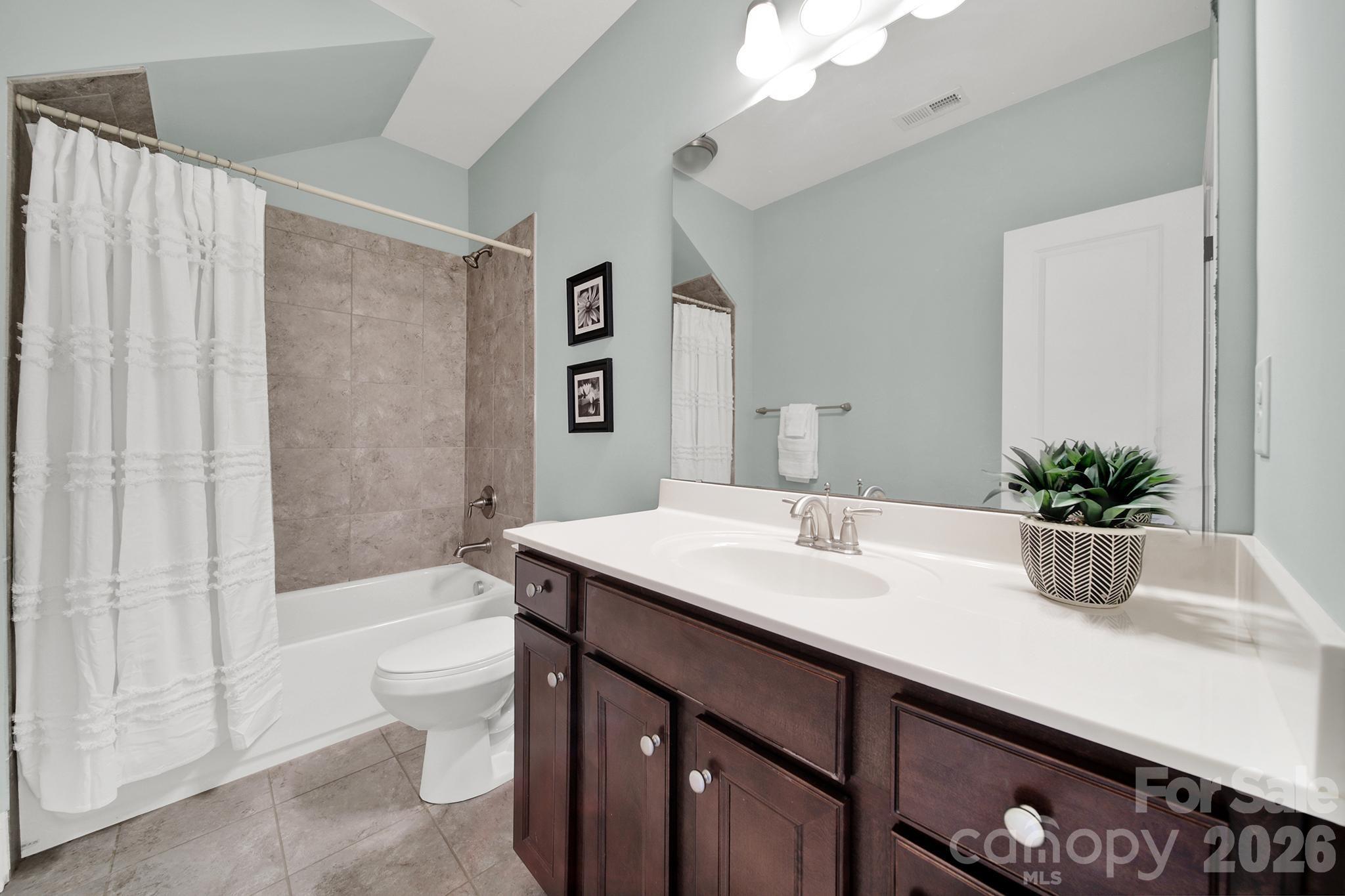 2112 Tatton Hall Road Fort Mill, SC 29715 - Photo 24 of 46 a bathroom with a sink a toilet and shower
