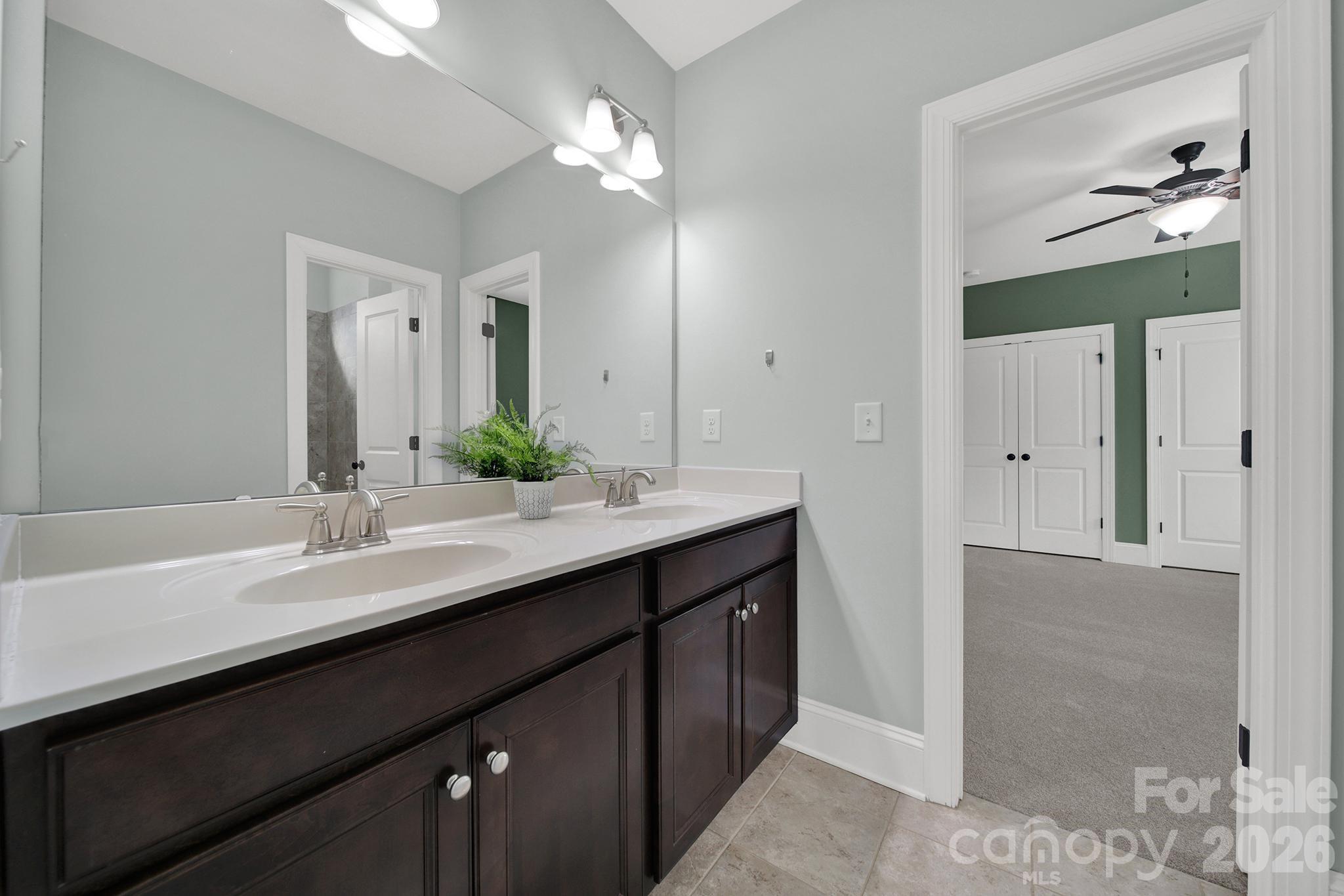 2112 Tatton Hall Road Fort Mill, SC 29715 - Photo 26 of 46 a bathroom with a double vanity sink and a mirror
