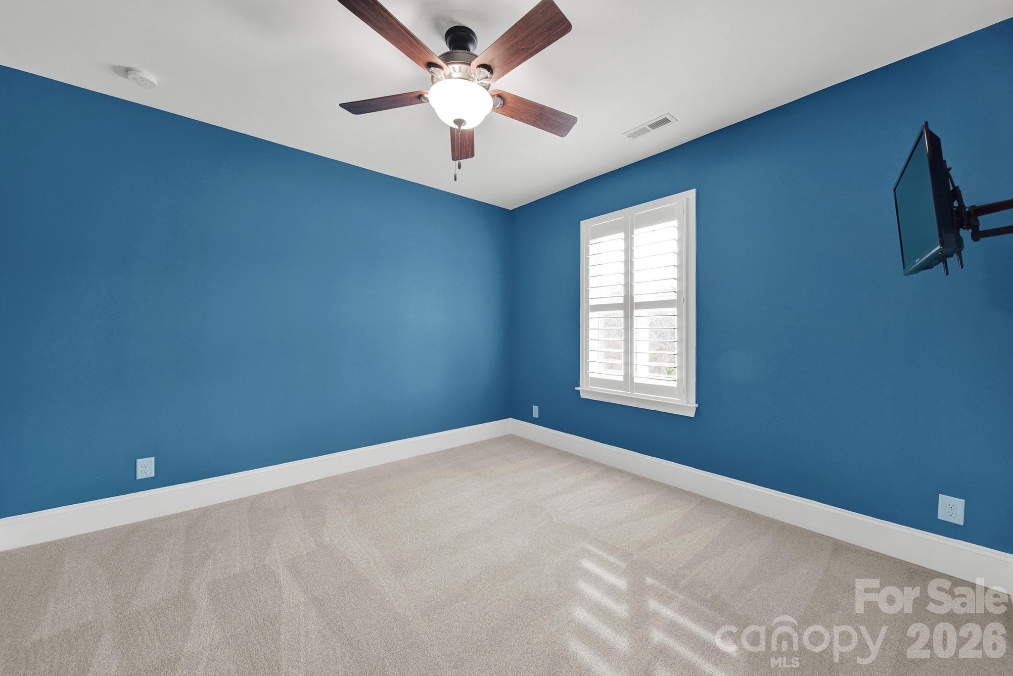 2112 Tatton Hall Road Fort Mill, SC 29715 - Photo 27 of 46 en empty room with windows and ceiling fan