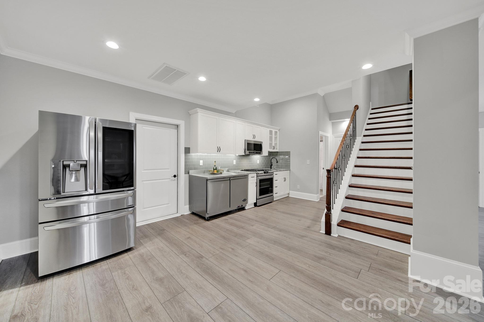 2112 Tatton Hall Road Fort Mill, SC 29715 - Photo 28 of 46 a kitchen with stainless steel appliances a refrigerator and a stove top oven