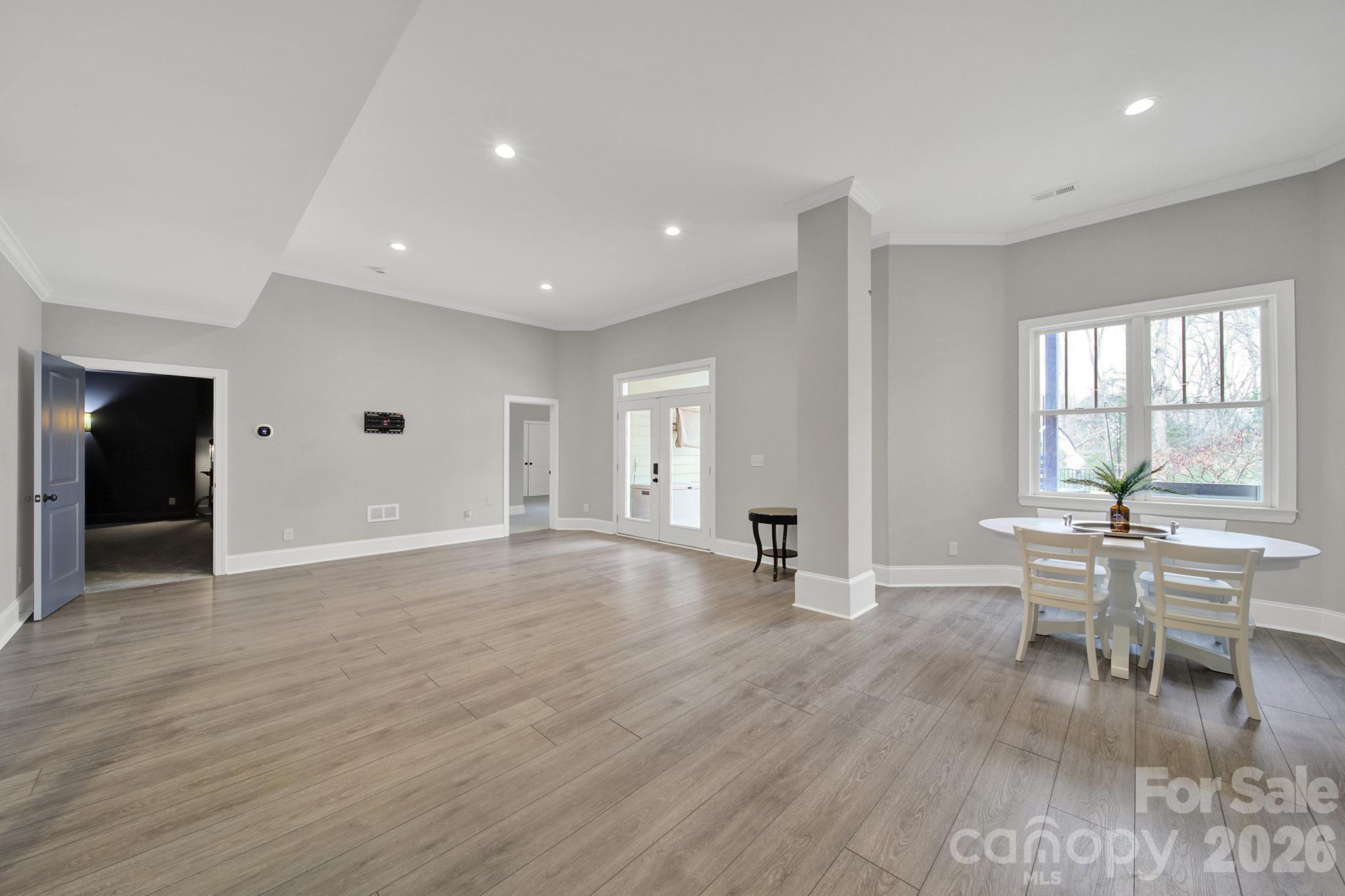 2112 Tatton Hall Road Fort Mill, SC 29715 - Photo 29 of 46 an empty room with wooden floor and furniture