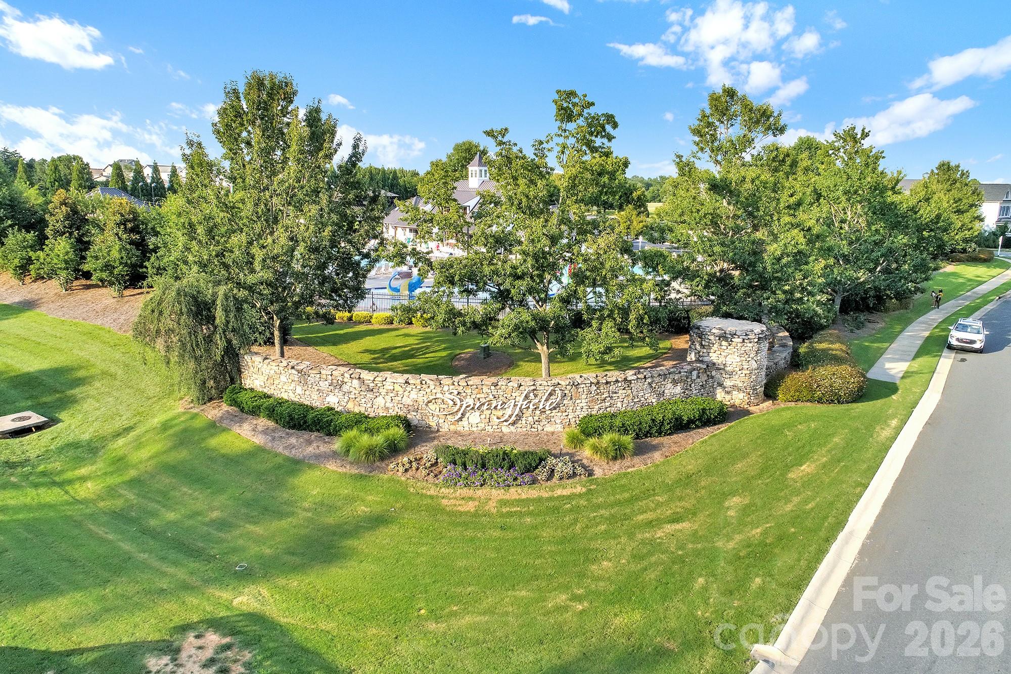 2112 Tatton Hall Road Fort Mill, SC 29715 - Photo 46 of 46 a view of a garden with a fountain