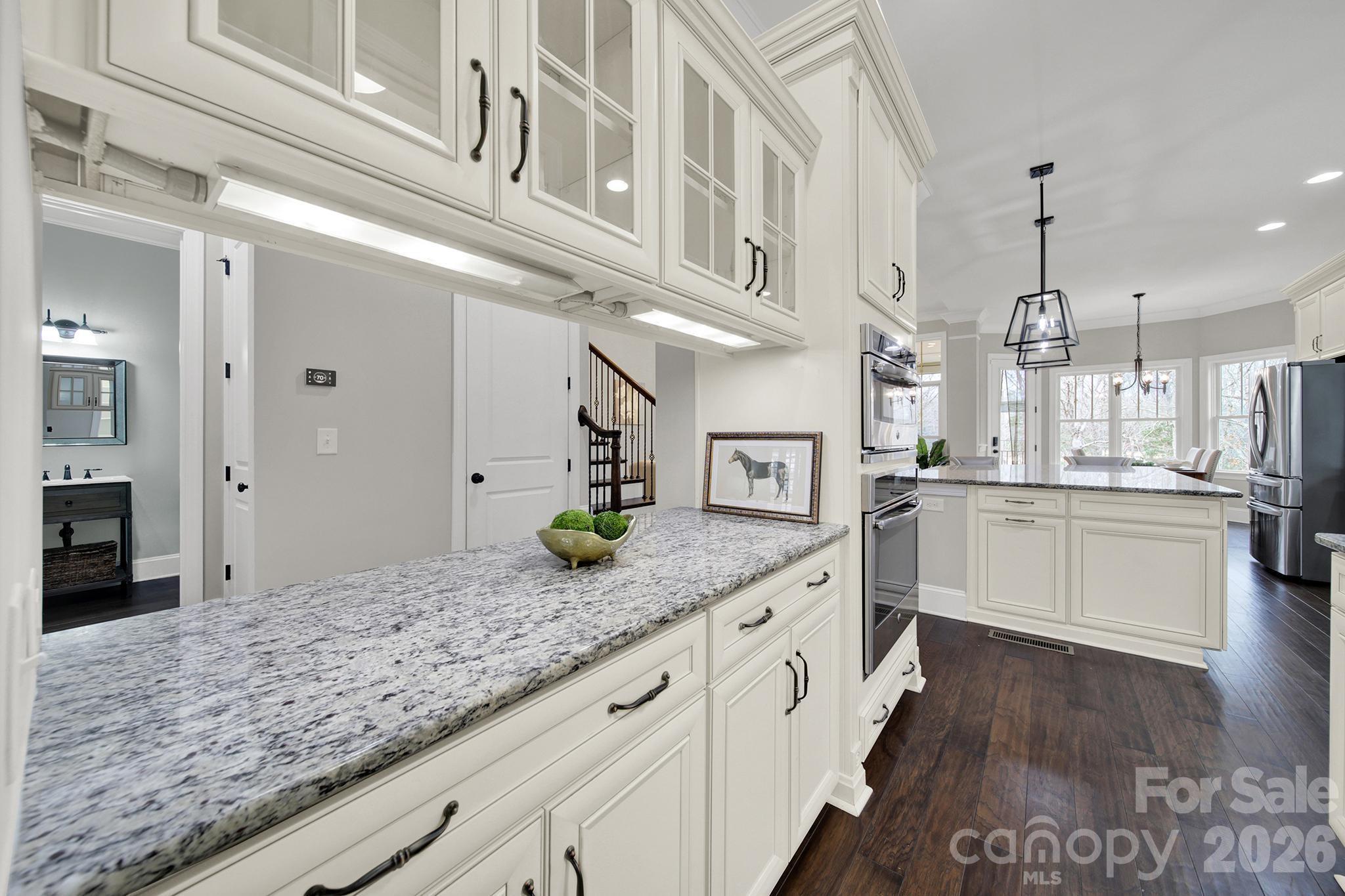 2112 Tatton Hall Road Fort Mill, SC 29715 - Photo 6 of 46 a kitchen with stainless steel appliances granite countertop a sink and cabinets
