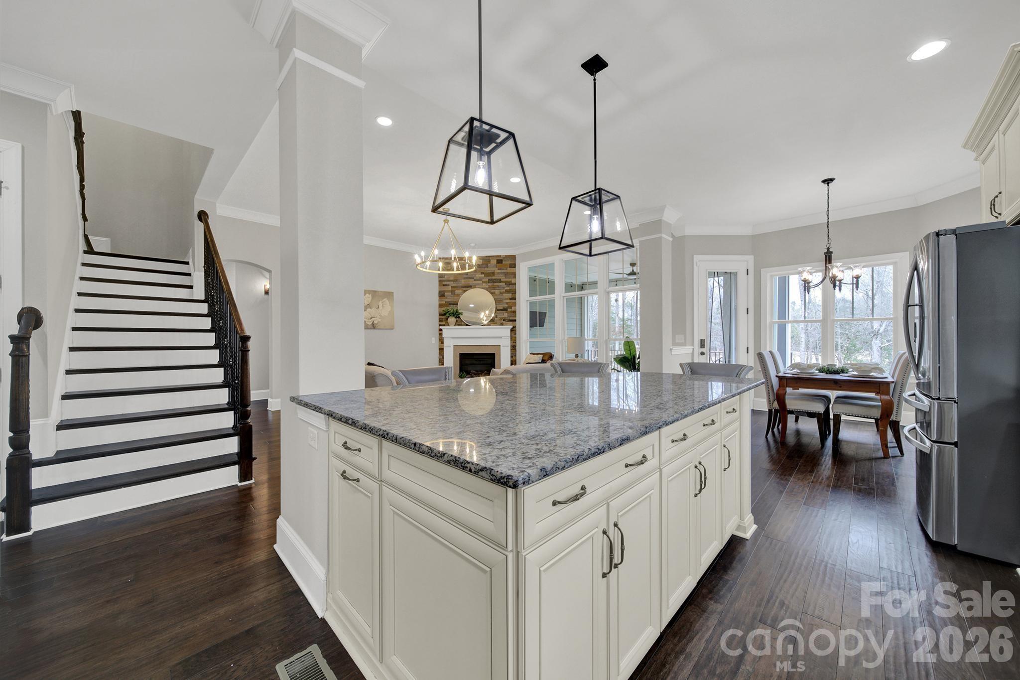 2112 Tatton Hall Road Fort Mill, SC 29715 - Photo 8 of 46 a kitchen with stainless steel appliances granite countertop a sink a oven and a wooden floors
