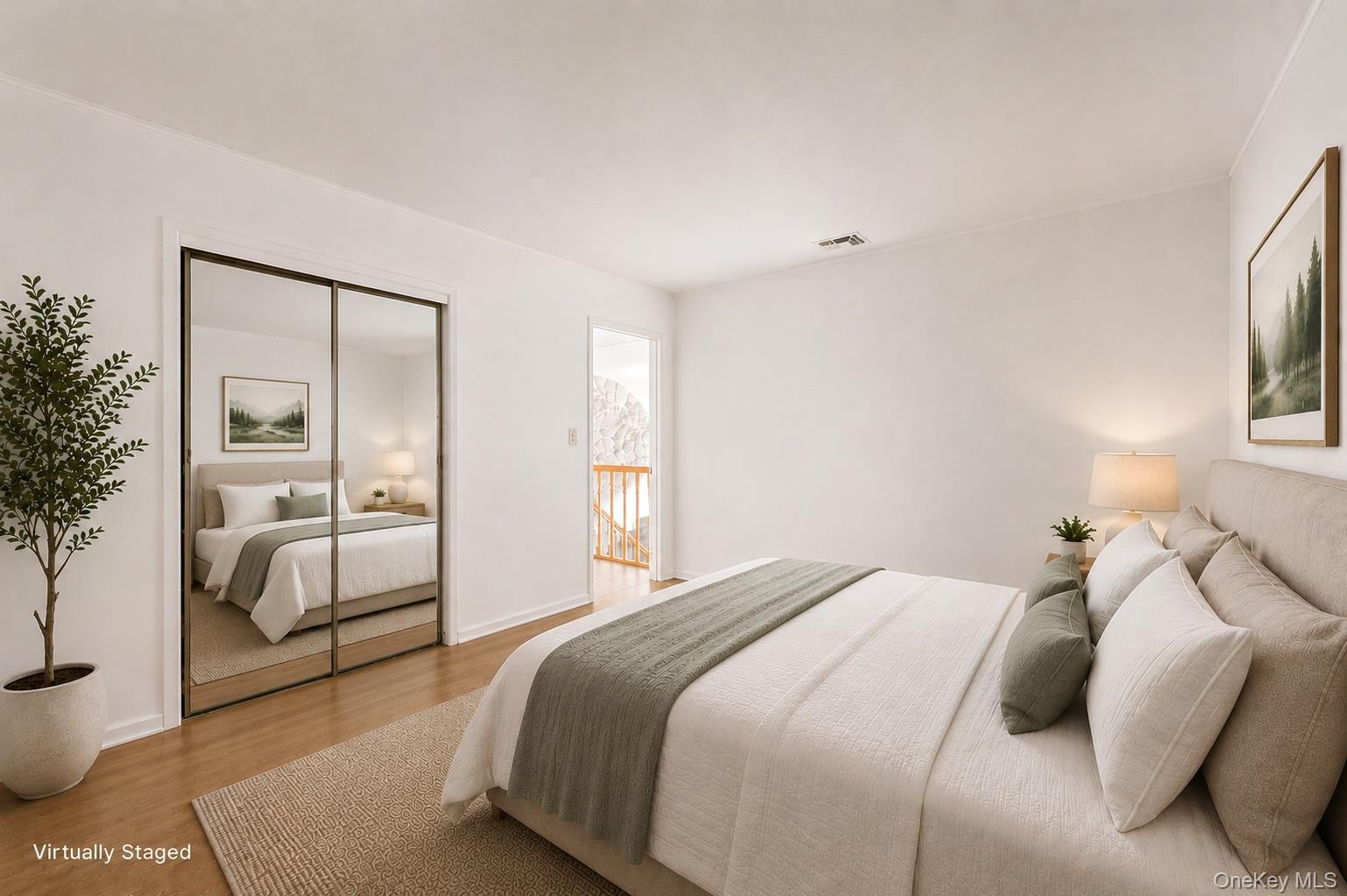 59 Maybrook Road North Babylon, NY 11703 - Photo 15 of 43 a bedroom with a large bed and a potted plant